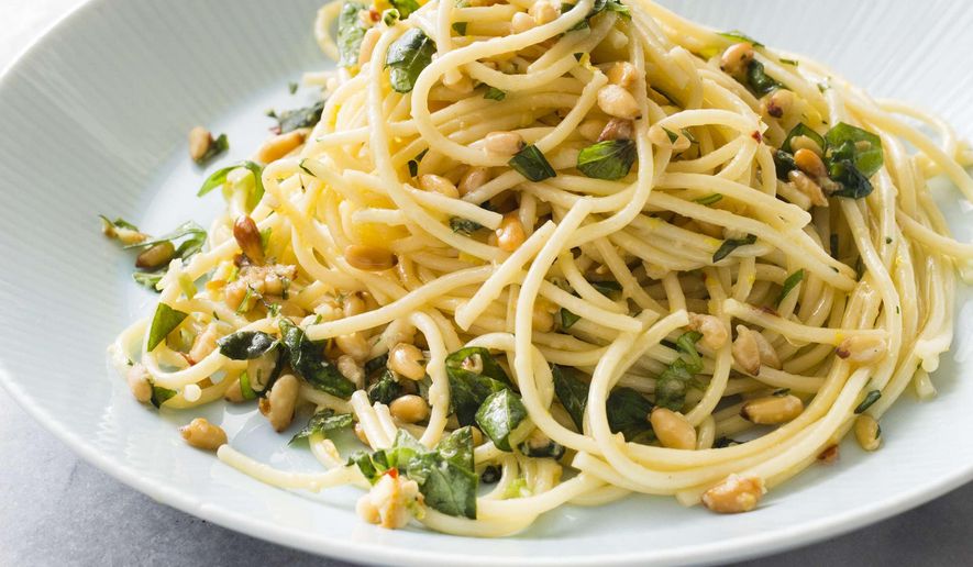 This undated photo provided by America's Test Kitchen in March 2019 shows Garlicky Spaghetti in Brookline, Mass. This recipe appears in the cookbook "Vegetables Illustrated." (Carl Tremblay/America's Test Kitchen via AP)