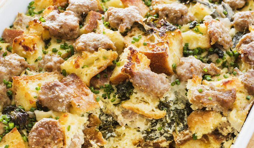 This undated photo provided by America's Test Kitchen in March 2019 shows Savory Bread Pudding in Brookline, Mass. This recipe appears in the cookbook "All-Time Best Brunch." (Daniel J. van Ackere/America's Test Kitchen via AP)