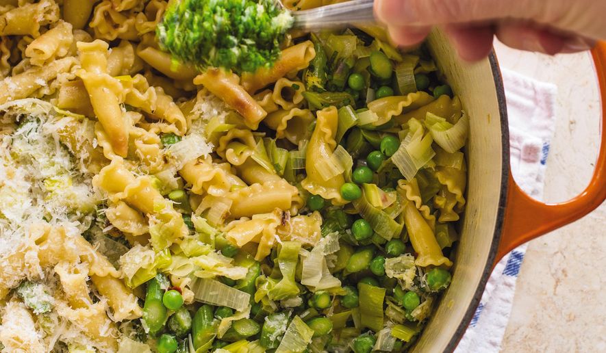 This undated photo provided by America's Test Kitchen in March 2019 shows Spring Vegetable Pasta in Brookline, Mass. This recipe appears in the cookbook "Revolutionary Recipes." (Carl Tremblay/America's Test Kitchen via AP)