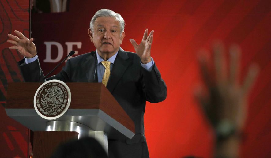 FILE - In this Friday, March 8, 2019 file photo, Mexican President Andres Manuel Lopez Obrador answers questions from journalists at his daily 7 a.m. press conference at the National Palace in Mexico City. Lopez Obrador said he sent a letter to Spain and the Vatican on March 1, asking them to apologize for the conquest of the Americas five centuries ago. (AP Photo/Marco Ugarte, File)