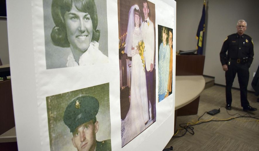 Photos of Linda and Clifford Bernhardt, who were killed in 1973, are displayed at a press conference at the Yellowstone County administrative offices in Billings, Montana on Monday, March 25, 2019. Yellowstone County Sheriff Mike Linder, pictured at right, says authorities have identified the couple's now-deceased killer. (AP Photo/Matthew Brown)