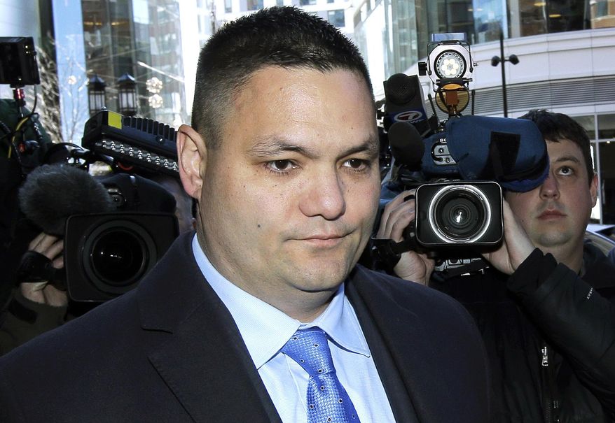 Suspended Massachusetts State Police Trooper Eric Chin, of Hanover, Mass., departs federal court in Boston on Monday, March 25, 2019, after being sentenced for collecting unworked overtime pay. Chin is one of several troopers who pleaded guilty to charges in the department's overtime abuse scandal. (AP Photo/Steven Senne)