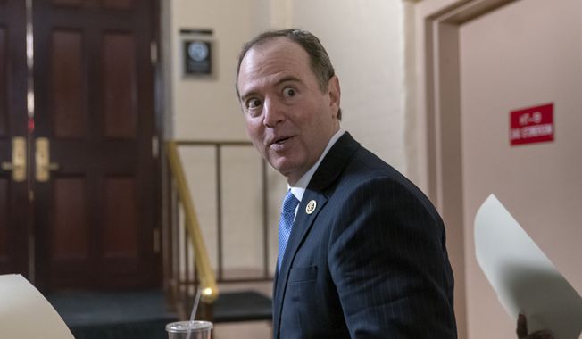 House Intelligence Committee Chairman Adam Schiff, D-Calif., arrives for a Democratic Caucus meeting at the Capitol in Washington, Tuesday, March 26, 2019. Schiff, the focus of Republicans&#x27; post-Mueller ire, says Mueller&#x27;s conclusion would not affect his own committee&#x27;s counterintelligence probes. (AP Photo/J. Scott Applewhite)