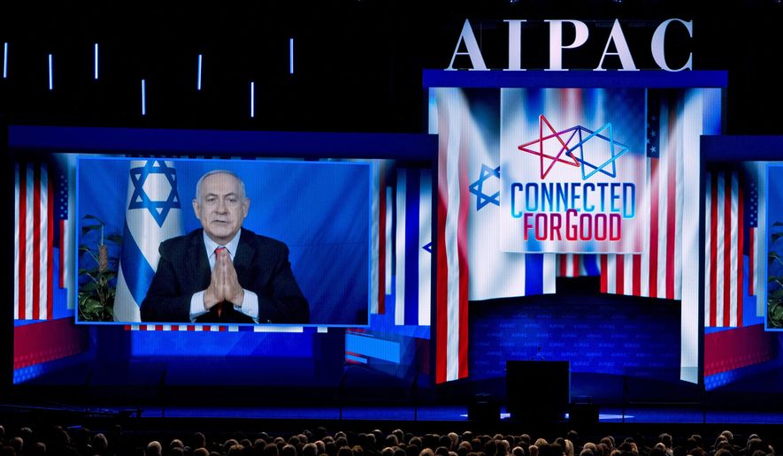 Israeli Prime Minister Benjamin Netanyahu speaks on a video from Israel to the 2019 American Israel Public Affairs Committee (AIPAC) policy conference, at Washington Convention Center, in Washington, Tuesday, March 26, 2019. (AP Photo/Jose Luis Magana)