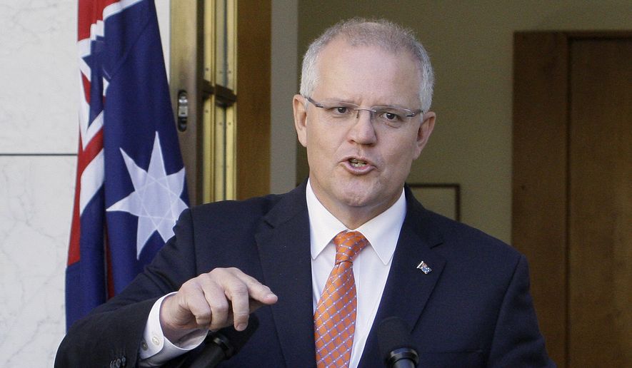 In this Feb. 13, 2019, file photo Australian Prime Minister Scott Morrison addresses media at Parliament House in Canberra. Morrison, on Tuesday, March 26, 2019, accused an influential minor political party of trying to &amp;quot;sell Australia&#x27;s gun laws to the highest bidders&amp;quot; by asking the U.S. gun lobby for donations. (AP Photos/Rod McGuirk, File)