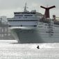 In this June 20, 2016, file photo, a jet skier passes in front of the Carnival Sensation cruise ship as it leaves PortMiami, in Miami Beach, Fla. (AP Photo/Lynne Sladky, File) **FILE**
