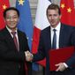 President of Airbus&#39;s commercial aircraft business, Guillaume Faury, right, and Chairman of China Aviation Supplies Co. (CASC) Jia Baojun, left, shake hands during an agreement signing ceremony at the Elysee Palace in Paris, France, Monday, March 25, 2019. (Yoan Valat/Pool Photo via AP) ** FILE **