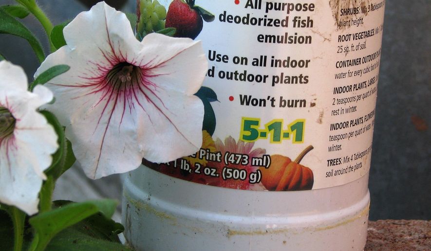 This undated photo shows houseplant fertilizer in New Paltz, N.Y. Houseplants can be fertilized in a variety of ways, and a soluble, organic fertilizer derived from fish is one such way. (Lee Reich via AP)
