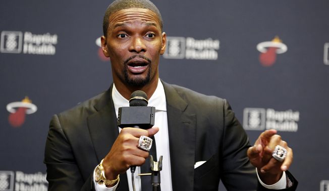 Former Miami Heat player Chris Bosh speaks at a press conference before the team&#x27;s retirement of his jersey at halftime of an NBA game between the Heat and the Orlando Magic, Tuesday, March 26, 2019, in Miami. Bosh played 13 seasons, the first seven in Toronto and the last six in Miami. He averaged 19.2 points and 8.5 rebounds, was an All-Star 11 times and won two championships. (AP Photo/Joe Skipper)