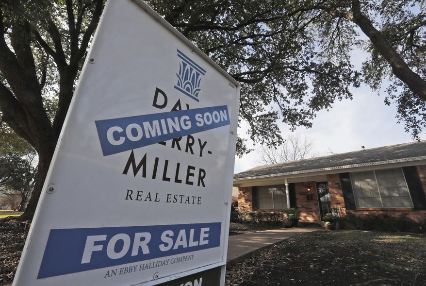 FILE- In this Feb. 20, 2019, file photo a coming soon for sale sign sits in front of a home in the Dallas suburb of Richardson, Texas. On Tuesday, March 26, the Standard & Poor's/Case-Shiller 20-city home price index for January is released. (AP Photo/LM Otero, File)