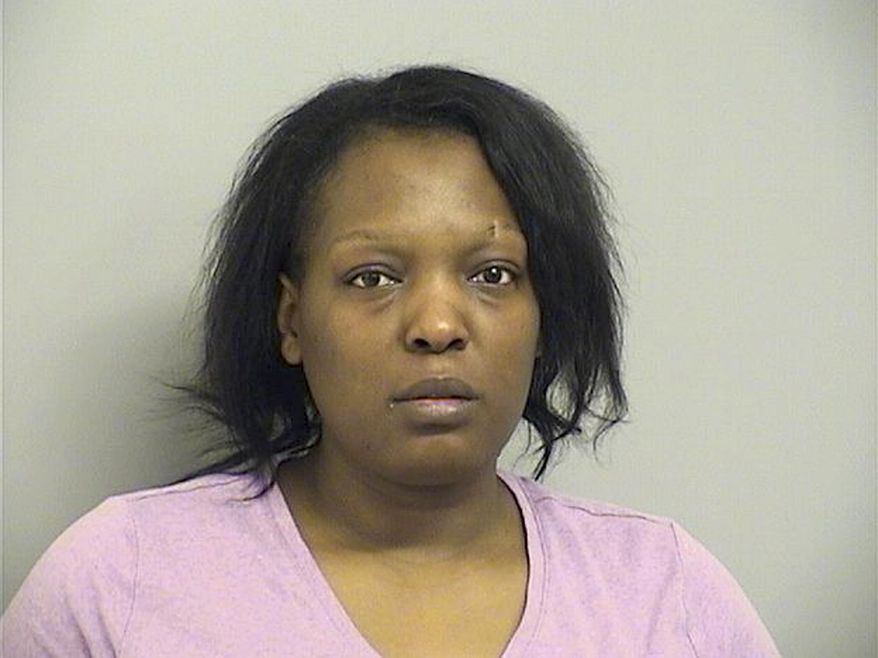 In this Tuesday, March 26, 2019, booking provided by the Tulsa County Sheriff's Department, shows 25-year-old Deionna Young who is being held without bond Tuesday on a first-degree murder charge in Tulsa. Police say Young, an Oklahoma restaurant manager, has been charged with killing an abusive customer, Desean Tallent, after reporting he threatened her, left and then returned. Police say Tallent later returned, but drove off. Young followed and allegedly shot him, then returned to work. (Tulsa County Sheriff's Department via AP)