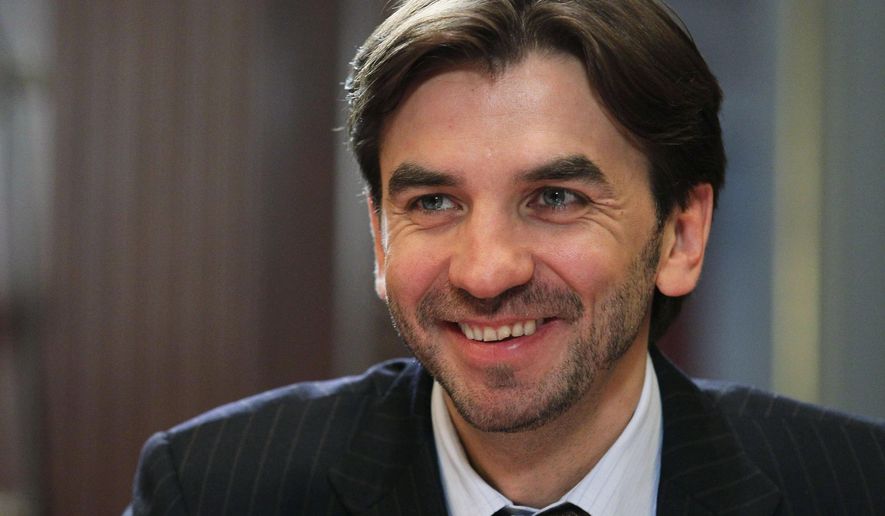 FILE - In this Wednesday, Jan. 18, 2012 file photo former Minister in charge of the "Open Government" Mikhail Abyzov, smiles in the Gorki residence outside Moscow. Russian Investigative Committee officials said Tuesday March 26, 2019, that Abyzov, who was a member of the Russian Cabinet in 2012-2018, has been arrested on charges of fraud. (AP Photo/RIA Novosti, Yekaterina Shtukina, Presidential Press Service, File)