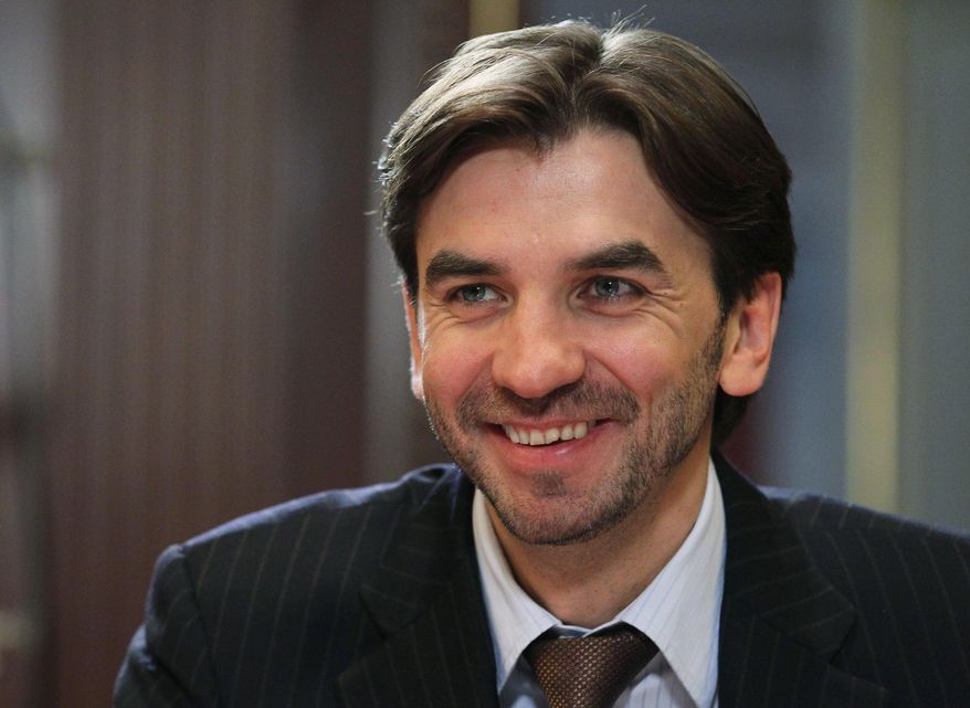 FILE - In this Wednesday, Jan. 18, 2012 file photo former Minister in charge of the "Open Government" Mikhail Abyzov, smiles in the Gorki residence outside Moscow. Russian Investigative Committee officials said Tuesday March 26, 2019, that Abyzov, who was a member of the Russian Cabinet in 2012-2018, has been arrested on charges of fraud. (AP Photo/RIA Novosti, Yekaterina Shtukina, Presidential Press Service, File)