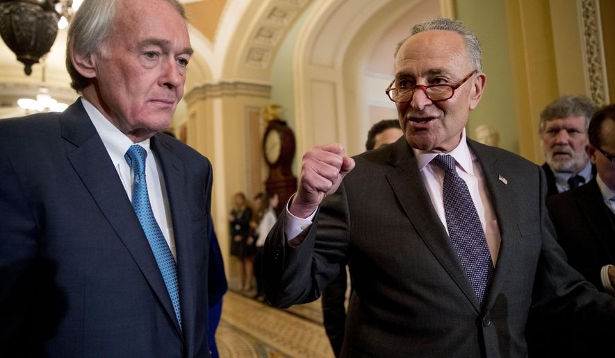 Senate Minority Leader Sen. Chuck Schumer of N.Y., right, accompanied by Sen. Ed Markey, D-Mass., left, speaks to members of the media following a Senate policy luncheon on Capitol Hill in Washington, Tuesday, March 26, 2019. (AP Photo/Andrew Harnik) ** FILE **