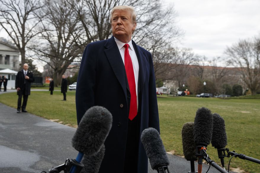 President Donald Trump listens to a question as he speaks with reporters before boarding Marine One on the South Lawn of the White House, Friday, March 22, 2019, in Washington. (AP Photo/Evan Vucci) **FILE**