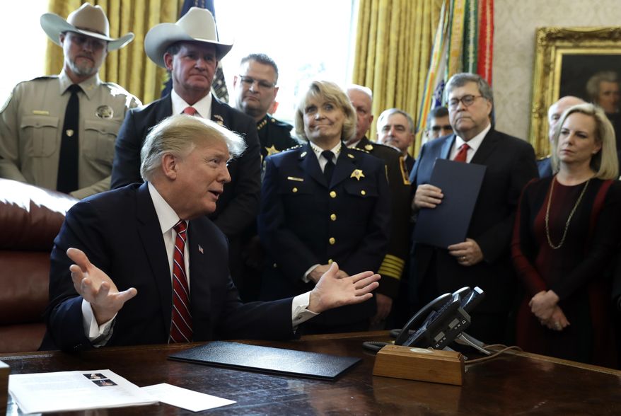 President Donald Trump speaks about border security in the Oval Office of the White House, Friday, March 15, 2019, in Washington. Trump issued the first veto of his presidency, overruling Congress to protect his emergency declaration for border wall funding. (AP Photo/Evan Vucci) ** FILE **