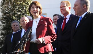 Rep. Cathy McMorris Rodgers, R-Wa., together with Rep. Kevin Brady, R-Texas, left, Rep. Rep. Steve Scalise, R-La., right, Rep. Vern Buchanan, R-Fla., second from right, and other Republican members of Congress speaks to reporters outside the West Wing of the White House following a meeting with President Donald Trump at the White House in Washington, Tuesday, March 26, 2019. (AP Photo/Manuel Balce Ceneta)