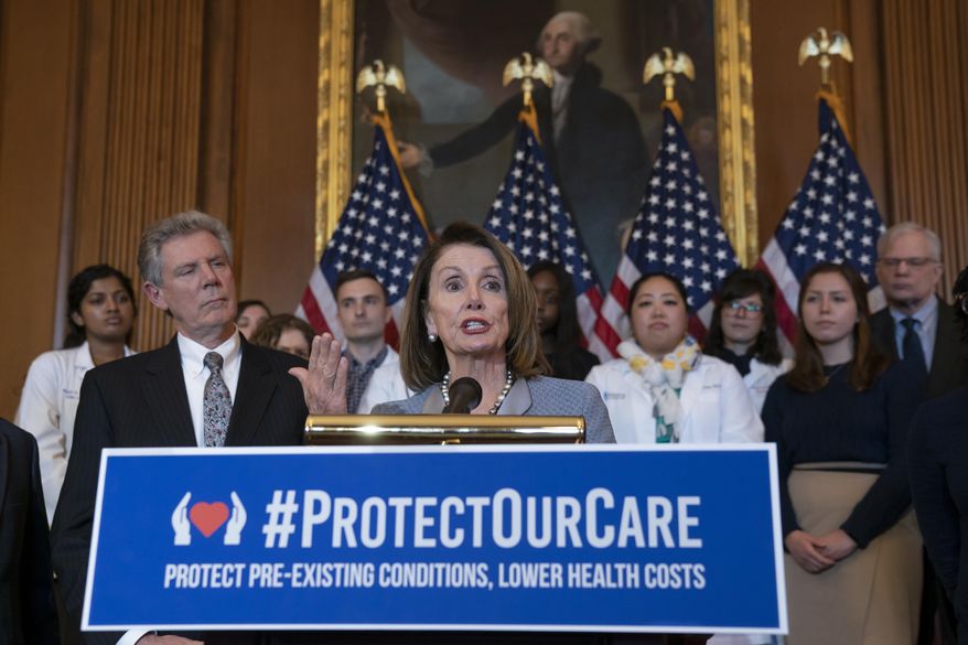 Speaker of the House Nancy Pelosi, D-Calif., joined at left by Energy and Commerce Committee Chair Frank Pallone, D-N.J., speaks at an event to announce legislation to lower health care costs and protect people with pre-existing medical conditions, at the Capitol in Washington, Tuesday, March 26, 2019. The Democratic action comes after the Trump administration told a federal appeals court that the entire Affordable Care Act, known as "Obamacare," should be struck down as unconstitutional. (AP Photo/J. Scott Applewhite)