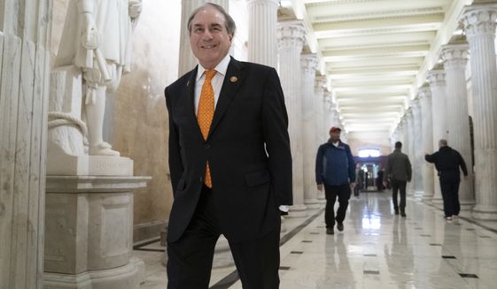 House Budget Committee Chair John Yarmuth, D-Ky., walks through the Hall of Columns at the Capitol as House Democratic chairs gather for a meeting with Majority Leader Steny Hoyer, D-Md., in Washington, Wednesday, March 27, 2019. (AP Photo/J. Scott Applewhite)