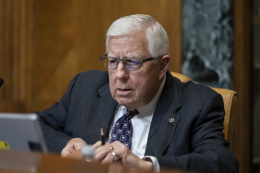 Sen. Mike Enzi, R-Wyo., chairman of the Senate Budget Committee, prepares for the markup of the fiscal year 2020 budget resolution, on Capitol Hill in Washington, Wednesday, March 27, 2019. (AP Photo/J. Scott Applewhite)