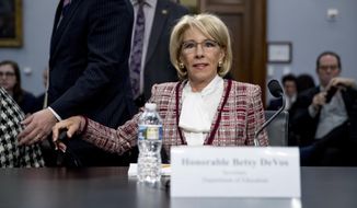 Education Secretary Betsy DeVos arrives for a House Appropriations subcommittee hearing on the budget on Capitol Hill in Washington, Tuesday, March 26, 2019. (AP Photo/Andrew Harnik)
