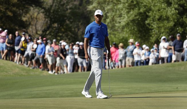 Tiger Woods prepares to putt on the 16th hole during round-robin play at the Dell Match Play Championship golf tournament Wednesday, March 27, 2019, in Austin, Texas. (AP Photo/Eric Gay)