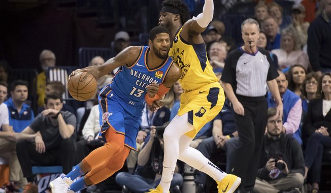 Oklahoma City Thunder forward Paul George (13) fights for position while defended by Indiana Pacers guard Wesley Matthews (23) during the first half of an NBA basketball game Wednesday, March 27, 2019, in Oklahoma City. (AP Photo/Rob Ferguson)