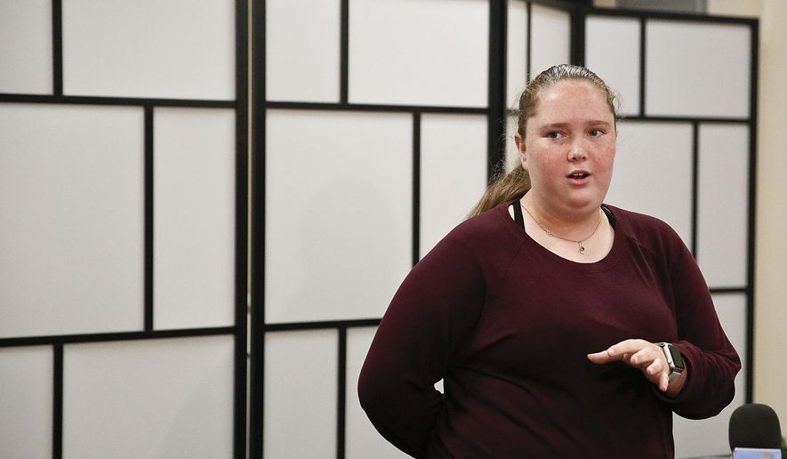 Annabel Claprood, 18, a former Marjory Stoneman Douglas High School student, speaks to the media about the opening of Eagles Haven, a new wellness center created for the MSD community, Wednesday, March 27, 2019, in Coral Springs, Fla. (AP Photo/Brynn Anderson)
