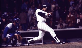 Yankees&#39; slugger Reggie Jackson connects for his third home run in the eighth inning off a pitch from the Dodgers&#39; Charlie Hough during game 6 of the World Series against the Los Angeles Dodgers at Yankee Stadium in New York on Oct. 18, 1977.  New York won the game 8-4, for their 21st World Series championship.  (AP Photo)