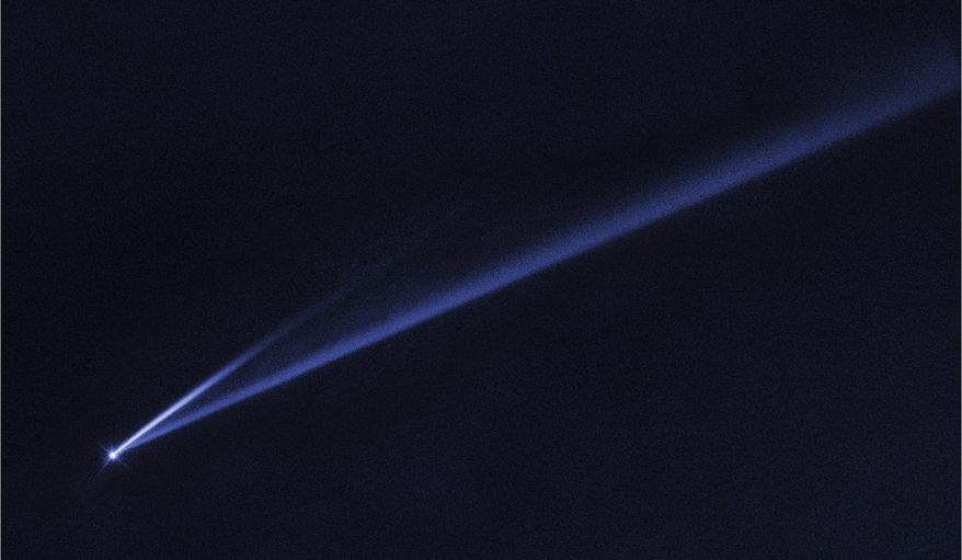 This undated photo captured by the Hubble Space Telescope and made available by NASA on Thursday, March 28, 2019 shows the asteroid (6478) Gault that is gradually self-destructing. A newly discovered asteroid (not pictured) has a tiny chance of smacking Earth in 2032, space agency officials said Wednesday. (NASA/ESA/K. Meech, J. Kleyna - University of Hawaii/O. Hainaut - European Southern Observatory via AP)