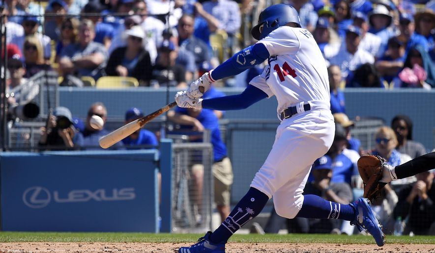 Los Angeles Dodgers&#39; Enrique Hernandez hits a two-run home run during the fourth inning of a baseball game against the Arizona Diamondbacks, Thursday, March 28, 2019, in Los Angeles. (AP Photo/Mark J. Terrill)