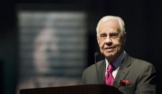 In this Monday, Jan. 21, 2019, file photo, L. Douglas Wilder speaks during the 34th Annual MLK Holiday Luncheon Celebration at The Lansing Center in downtown Lansing, Mich. A Virginia student who worked with Wilder, the nation’s first elected African-American governor, is accusing him of sexually harassing her by kissing her without consent. (Matthew Dae Smith/Lansing State Journal via AP, File)
