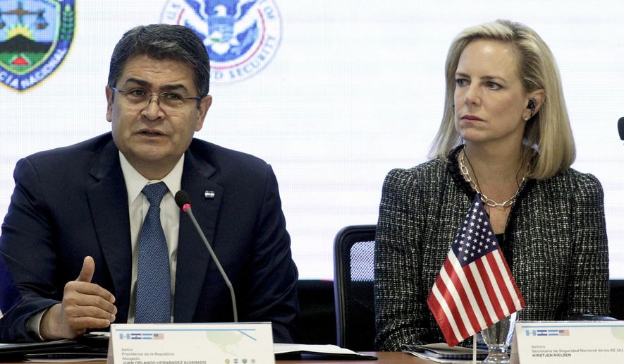 Honduran President Juan Orlando Hernandez , left, speaks as Secretary of Homeland Security Kirstjen Nielsen listens during a meeting in Tegucigalpa, Honduras Wednesday, March 27, 2019. The Secretary of National Security of the United States will discuss with his colleagues from the Northern Triangle a series of actions to counter organized crime and illegal trafficking of migrants and drugs to his country from Central America. (AP Photo/Fernando Antonio)