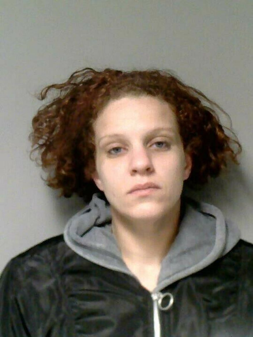 This photo provided by Lansing Police Department shows Ashley Shade. Police say they've arrested Shade, who had been sought since earlier this month after authorities found the body of her 6-day-old daughter in her car. Lansing police announced Thursday, March 28, 2019 that Shade was arrested without incident on previous criminal charges from several jurisdictions. (Lansing Police Department via AP)