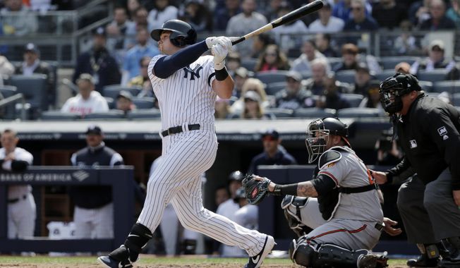 New York Yankees&#x27; Luke Voit hits a three-run homer during the first inning of an opening day baseball game against the Baltimore Orioles at Yankee Stadium, Thursday, March 28, 2019, in New York. (AP Photo/Seth Wenig)