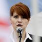 In this April 21, 2013, file photo, Maria Butina, leader of a pro-gun organization in Russia, speaks to a crowd during a rally in support of legalizing the possession of handguns in Moscow, Russia. (AP Photo/File)