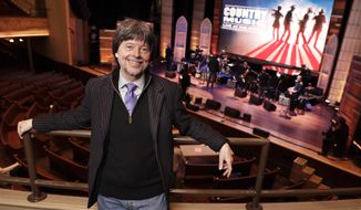 Filmmaker Ken Burn poses in the Ryman Auditorium Wednesday, March 27, 2019, in Nashville, Tenn. The Ryman was home to the Grand Ole Opry from 1943 to 1974. Burns hit the road this month on a bus trip to preach the gospel of &amp;quot;Country Music,&amp;quot; his new PBS film airing in September. (AP Photo/Mark Humphrey)