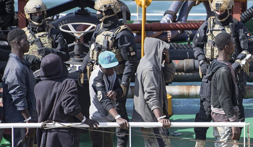 Armed forces stand onboard the Turkish oil tanker El Hiblu 1, which was hijacked by migrants, in Valletta, Malta, Thursday March 28, 2019. A Maltese special operations team on Thursday boarded a tanker that had been hijacked by migrants rescued at sea, and returned control to the captain, before escorting it to a Maltese port. (AP Photo/Rene' Rossignaud)