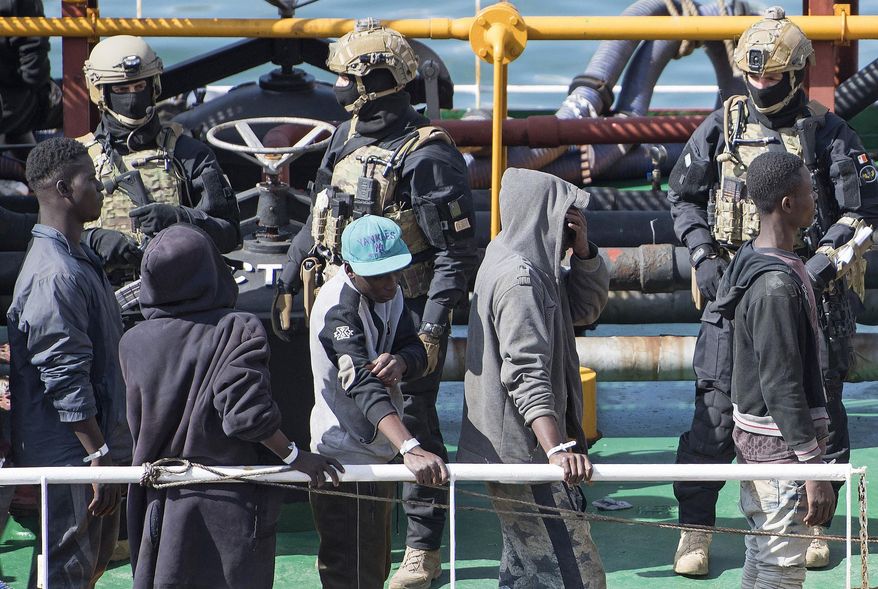 Armed forces stand onboard the Turkish oil tanker El Hiblu 1, which was hijacked by migrants, in Valletta, Malta, Thursday March 28, 2019. A Maltese special operations team on Thursday boarded a tanker that had been hijacked by migrants rescued at sea, and returned control to the captain, before escorting it to a Maltese port. (AP Photo/Rene' Rossignaud)