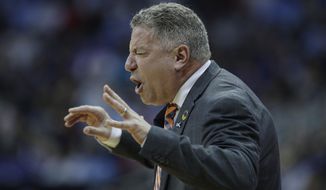 Auburn head coach Bruce Pearl is seen on the sidelines during the first half of a men&#39;s NCAA tournament college basketball Midwest Regional semifinal game against North Carolina Friday, March 29, 2019, in Kansas City, Mo. (AP Photo/Charlie Riedel)