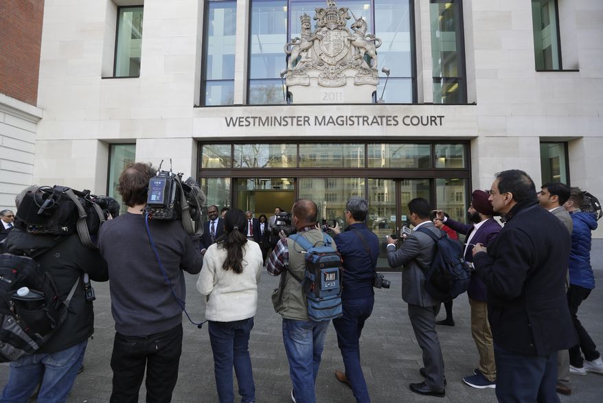 Journalists gather outside court after Indian diamond tycoon Nirav Modi was denied bail at Westminster Magistrates Court in London, Friday, March 29, 2019. Modi has been denied bail in London after Indian authorities alleged he was involved in a 1.8 billion US Dollar bank fraud. (AP Photo/Kirsty Wigglesworth)