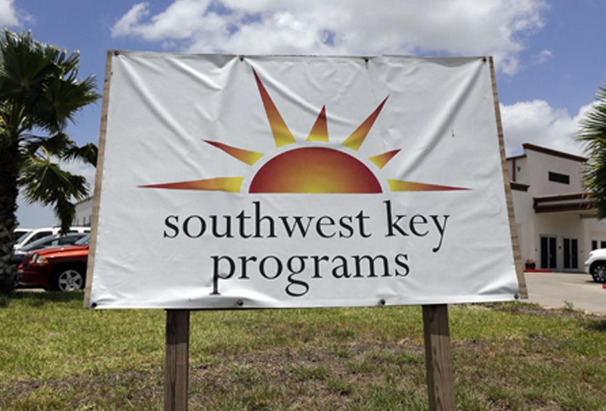 FILE - This June 20, 2014, file photo shows a Southwest Key program sign in Brownsville, Texas. Authorities in Arizona say workers who were seen on video dragging and shoving immigrant children being held at a privately run shelter won't face charges. The Maricopa County Attorney's Office said Friday, March 29, 2019 that there's no reasonable likelihood of proving the workers at a Southwest Key facility committed a crime. (AP Photo/Eric Gay, File)