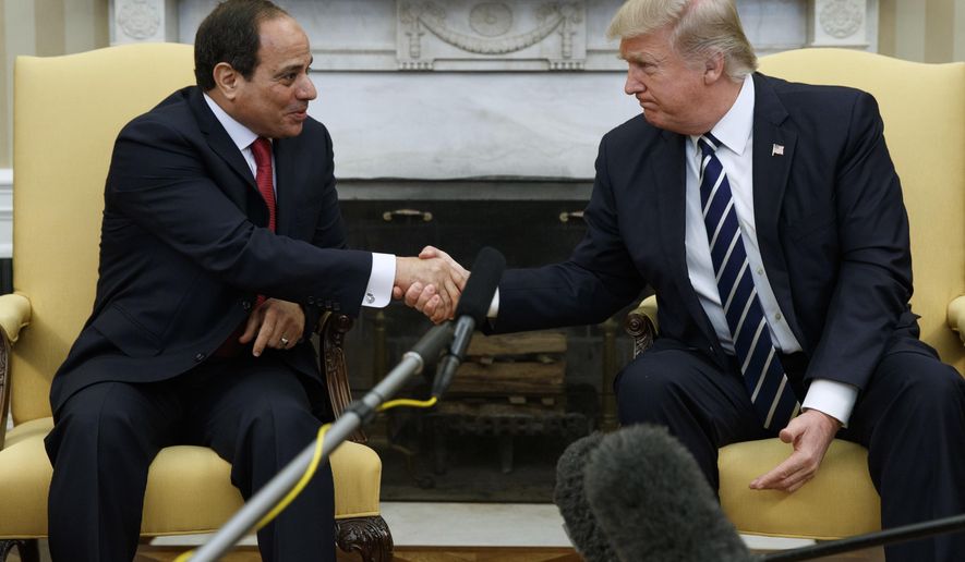 FILE - In this April 3, 2017 file photo, President Donald Trump shakes hands with Egyptian President Abdel Fattah el-Sisi in the Oval Office of the White House in Washington. Trump will meet with El-Sissi next month at the White House. (AP Photo/Evan Vucci)