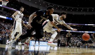 Gonzaga guard Josh Perkins, right, and Florida State guard PJ Savoy chase a loose ball during the second half an NCAA men&#39;s college basketball tournament West Region semifinal Thursday, March 28, 2019, in Anaheim, Calif. (AP Photo/Marcio Jose Sanchez)