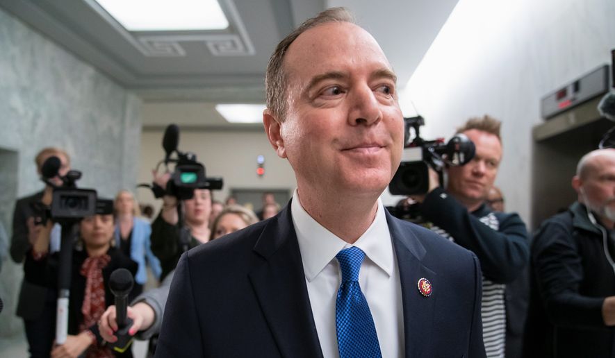 Adam Schiff, chairman of the House intelligence committee, evades reporters as he rushes to a vote during a committee hearing on Russia, on Capitol Hill in Washington, Thursday, March 28, 2019. (AP Photo/J. Scott Applewhite) ** FILE **