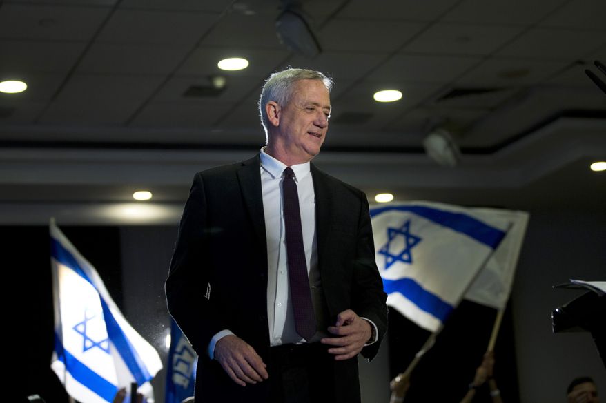 FILE - In this Wednesday, March 27, 2019 file photo, retired Israeli general Benny Gantz, one of the leaders of the Blue and White party, prepares to deliver a speech during election campaigning for elections to be held April 9, in Ramat Gan, Israel. Down in the polls, Israeli Prime Minister Benjamin Netanyahu’s Likud Party has released a new campaign trying to paint Gantz, his main rival, as mentally unstable. The video ads are the latest move in a campaign that has been heavy on personal insults and short on substance. (AP Photo/Oded Balilty, File)