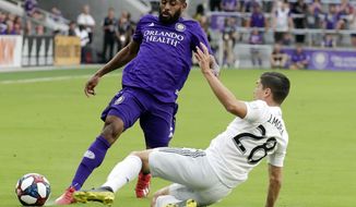 D.C. United&#39;s Joseph Mora, right, collides with Orlando City&#39;s Ruan, left, going after the ball during the first half of an MLS soccer match, Sunday, March 31, 2019, in Orlando, Fla. Mora was injured in the play and left the match. (AP Photo/John Raoux) ** FILE **