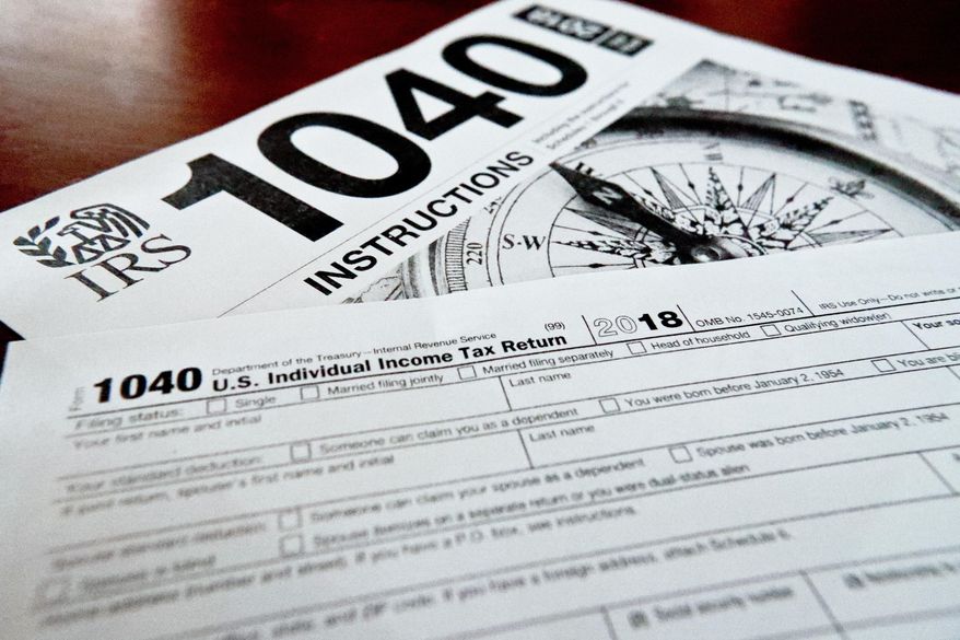 FILE- This Feb. 13, 2019, file photo shows multiple forms printed from the Internal Revenue Service web page that are used for 2018 U.S. federal tax returns in Zelienople, Pa. The tax overhaul changed how much employers withhold from paychecks. If you withhold too much, you are due a refund. If you withhold too little, you owe. While the government urged people to review their withholdings to make sure they were up to date, few did. As a result, some people got more money in their checks during the year but were surprised at tax time. (AP Photo/Keith Srakocic, File)
