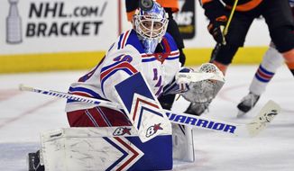 New York Rangers goaltender Alexandar Georgiev looks for the puck after making a save during the second period of an NHL hockey game against the Philadelphia Flyers, Sunday, March 31, 2019, in Philadelphia. (AP Photo/Derik Hamilton)