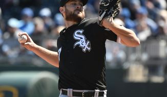 Chicago White Sox starting pitcher Lucas Giolito throws in the first inning of a baseball game against the Kansas City Royals, Sunday, March 31, 2019, in Kansas City, Mo. (AP Photo/Ed Zurga)